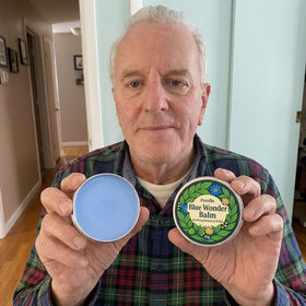 Happy customer holding Purella Blue Wonder Balm