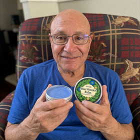 Happy customer holding Purella Blue Wonder Balm